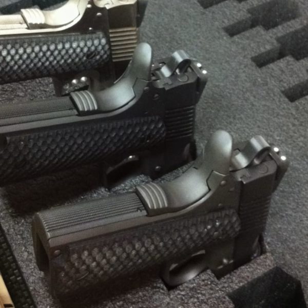 Foam inserts protect and secure pistols within each drawer.